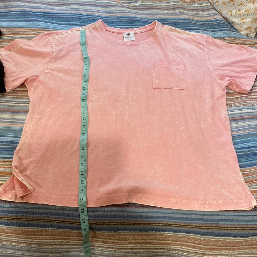 Women’s large pink T-shirt. Like love. Fits more like an extra large. Worn once
